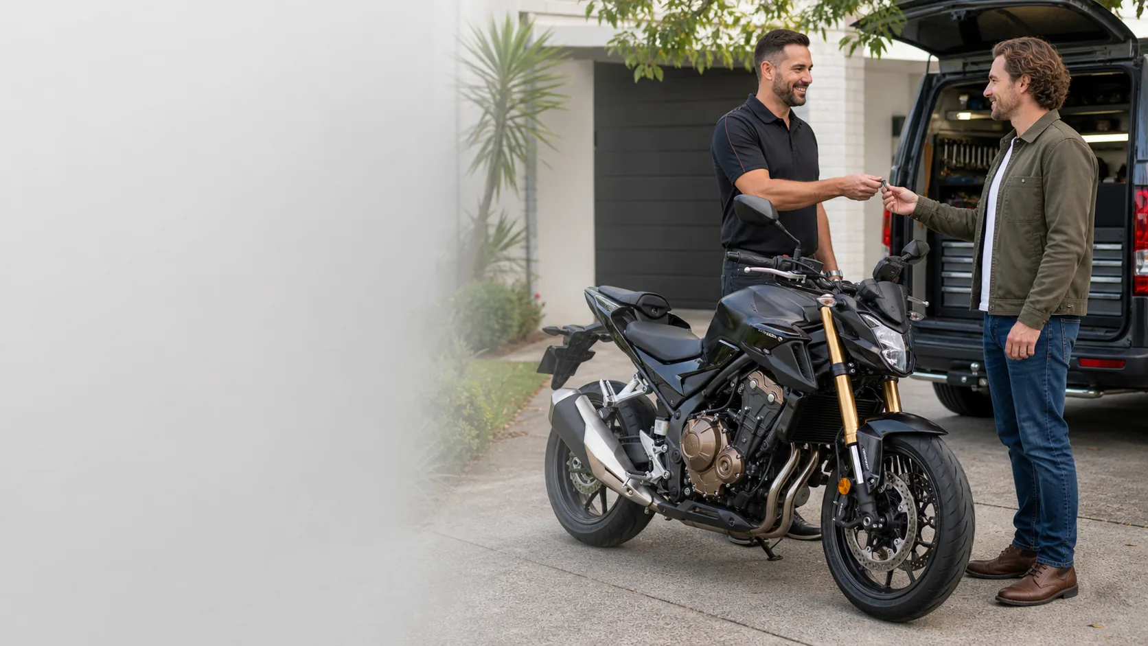 Motorcycle owner discussing a replacement key service